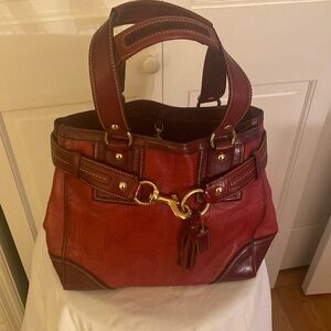 HANDCRAFTED, glove tanned cowhide red satchel, maroon accents. Gold hardware.